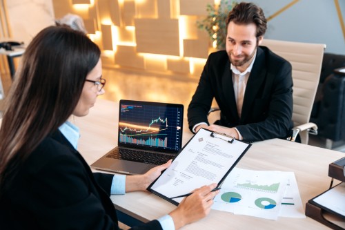 A business owner reviewing funding terms with an advisor