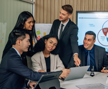 The Pinnacle Point Financial team reviewing a funding file together